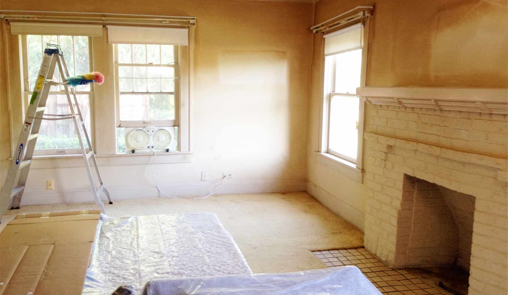 Anne's living room before repainting and carept removal.